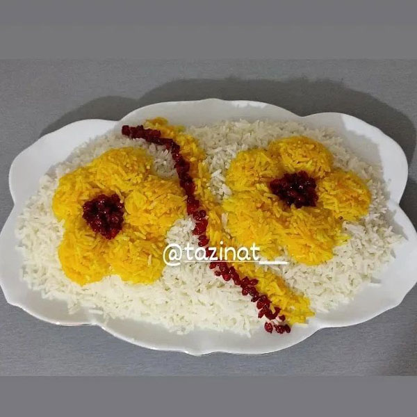 تزیین برنج ساده و زیبا تزیین برنج بدون قالب تزیین برنج مجلسی تزیین برنج در دیس بیضی تزیین برنج عروس تزیین برنج با زعفران عکس